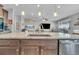 Modern kitchen with granite countertops, stainless steel appliances, and open to the living area at 23913 E Swallow Cir, Aurora, CO 80016