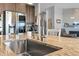 Close up of a kitchen sink with a granite countertop and stainless steel faucet at 23913 E Swallow Cir, Aurora, CO 80016