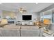 Comfortable living room with a fireplace, large TV, and plenty of seating at 23913 E Swallow Cir, Aurora, CO 80016