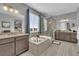 Luxurious main bathroom with a soaking tub, walk-in shower, and dual vanities at 23913 E Swallow Cir, Aurora, CO 80016