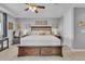 Spacious main bedroom with tray ceilings, a ceiling fan, and natural light at 23913 E Swallow Cir, Aurora, CO 80016