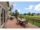 Expansive back deck with outdoor seating and dining areas, perfect for entertaining with serene views of the green space at 8532 W Eden Dr, Littleton, CO 80127