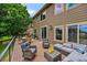 Spacious back deck with outdoor seating, ideal for entertaining and enjoying the backyard at 8532 W Eden Dr, Littleton, CO 80127