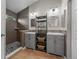 Contemporary bathroom featuring dual vanities, modern fixtures, and a tiled walk-in shower for a luxurious experience at 8532 W Eden Dr, Littleton, CO 80127