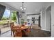 Open dining area with a view to the kitchen and access to a spacious outdoor deck, perfect for entertaining at 8532 W Eden Dr, Littleton, CO 80127