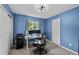 Well-lit home office with modern desk setup, ideal for productivity and remote work at 8532 W Eden Dr, Littleton, CO 80127