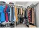 Spacious walk-in closet with ample storage and organizational options for clothes and accessories at 8532 W Eden Dr, Littleton, CO 80127