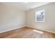 Bright bedroom featuring wood floors, fresh paint, and a window providing natural light at 2340 Geneva, Aurora, CO 80010