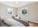 Cozy bedroom featuring natural light, neutral paint, and hardwood floors at 2340 Geneva, Aurora, CO 80010