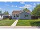 Charming single-story home featuring a well-maintained lawn, and quaint curb appeal at 2340 Geneva, Aurora, CO 80010