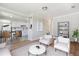 Open-concept living room with hardwood floors and white walls at 2340 Geneva, Aurora, CO 80010