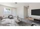 Comfortable living room with modern furnishings and large windows at 2340 Geneva, Aurora, CO 80010