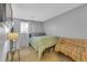 Cozy bedroom with a comfortable bed, couch and natural light from the window at 1611 Garfield Ave # 2, Louisville, CO 80027