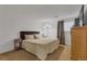 Well-lit bedroom featuring a queen-sized bed, neutral decor, and carpeted flooring at 1611 Garfield Ave # 2, Louisville, CO 80027