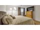 Spacious bedroom with a large bed, dresser, and natural light at 1611 Garfield Ave # 2, Louisville, CO 80027