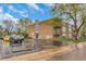 Brick apartment building with balconies and parking in front surrounded by mature trees at 1611 Garfield Ave # 2, Louisville, CO 80027