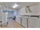 Well-equipped laundry room with multiple washers and dryers for resident convenience at 1611 Garfield Ave # 2, Louisville, CO 80027