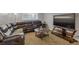 Living room with large comfortable seating, round wood table, and mounted TV at 1611 Garfield Ave # 2, Louisville, CO 80027