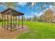 Outdoor picnic area with a gazebo, table, and a lush green lawn at 1611 Garfield Ave # 2, Louisville, CO 80027