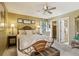 Bedroom boasts a walk-in closet, ceiling fan, and neutral decor at 7780 W 87Th Dr # E, Arvada, CO 80005