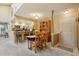 Cozy dining area with a view of the kitchen and an entry door, offering ample seating at 7780 W 87Th Dr # E, Arvada, CO 80005