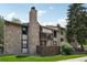 Charming exterior with stone accents and a private balcony at 7780 W 87Th Dr # E, Arvada, CO 80005
