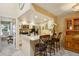 Bright, updated kitchen with granite countertops, stainless steel appliances, and breakfast bar seating at 7780 W 87Th Dr # E, Arvada, CO 80005