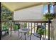 Cozy patio with table and chairs, perfect for relaxing outdoors at 7780 W 87Th Dr # E, Arvada, CO 80005