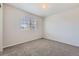 Bedroom with carpeted floor, neutral wall color and a window at 10037 Idalia St, Commerce City, CO 80022