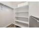 Walk-in closet with shelving and rod for hanging clothes at 10037 Idalia St, Commerce City, CO 80022