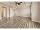 Spacious primary bedroom showcasing trey ceilings with ceiling fan and hardwood flooring at 10037 Idalia St, Commerce City, CO 80022