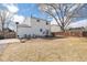 Expansive backyard showcasing a well-maintained lawn, a patio area, and mature trees for shade at 1277 W 135Th Pl, Broomfield, CO 80234