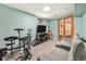 Finished basement offers a cozy den area with a large sectional and entertainment center at 1277 W 135Th Pl, Broomfield, CO 80234