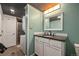 Functional laundry bathroom features a stackable washer dryer, wood ceiling and rustic accents at 1277 W 135Th Pl, Broomfield, CO 80234