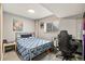 Bedroom has a modern bed frame and window bringing in natural light at 1277 W 135Th Pl, Broomfield, CO 80234