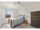 Bright bedroom with a large window offering natural light and a view of the outdoors at 1277 W 135Th Pl, Broomfield, CO 80234