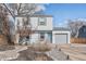 Charming two-story home with gray siding, a one-car garage, and xeriscaped front yard on a sunny day at 1277 W 135Th Pl, Broomfield, CO 80234