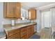 Kitchen with granite countertops, wood cabinets, and stainless steel dishwasher at 1277 W 135Th Pl, Broomfield, CO 80234