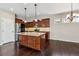 Modern kitchen with stainless steel appliances and an island at 21646 E Stroll Ave, Parker, CO 80138