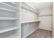 Spacious walk-in closet with ample shelving and hanging rods at 21646 E Stroll Ave, Parker, CO 80138