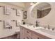 Double vanity bathroom with modern fixtures and a shower at 7212 S Acoma St, Littleton, CO 80120