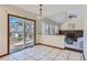 Bright dining area with sliding glass doors leading to deck at 7212 S Acoma St, Littleton, CO 80120