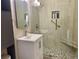 Updated bathroom with walk in shower and pebble flooring at 320 S Ames St # 5, Lakewood, CO 80226