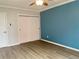 Cozy bedroom with ample closet space, stylish paint, and updated flooring at 320 S Ames St # 5, Lakewood, CO 80226