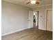 Bright bedroom with hardwood floors and view into kitchen at 320 S Ames St # 5, Lakewood, CO 80226