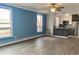 Spacious living room with updated flooring and blue accent wall at 320 S Ames St # 5, Lakewood, CO 80226