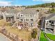 Backyard aerial view showcasing multi-level decks, hot tub, and landscaped yard at 8131 S Coolidge Way, Aurora, CO 80016