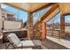 Covered patio area with hot tub and lounge chair, ideal for outdoor relaxation and privacy at 8131 S Coolidge Way, Aurora, CO 80016