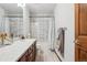 Bathroom featuring a shower-tub combination with modern patterned tiles, vanity, and updated finishes at 8131 S Coolidge Way, Aurora, CO 80016