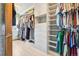 Walk-in closet is well-organized with custom shelving and ample storage space at 8131 S Coolidge Way, Aurora, CO 80016